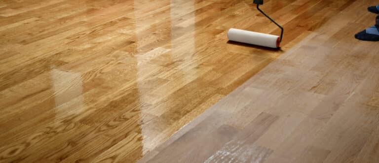 Lacquering,Wood,Floors.,Worker,Uses,A,Roller,To,Coating,Floors.