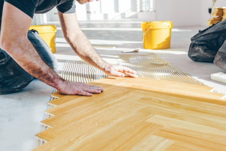 Craftsman,On,Work,Putting,Wood,Parquet,Pieces.,Home,Construction