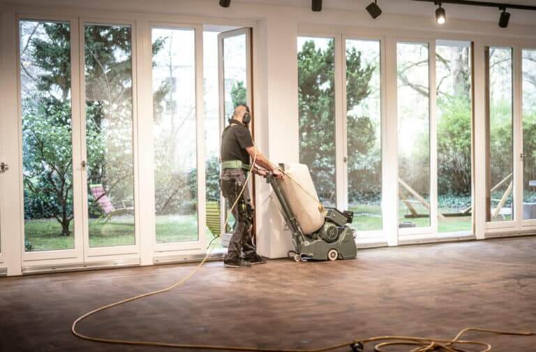 Craftsman,Grinds,A,Parquet,With,The,Hummel,Grinding,Machine