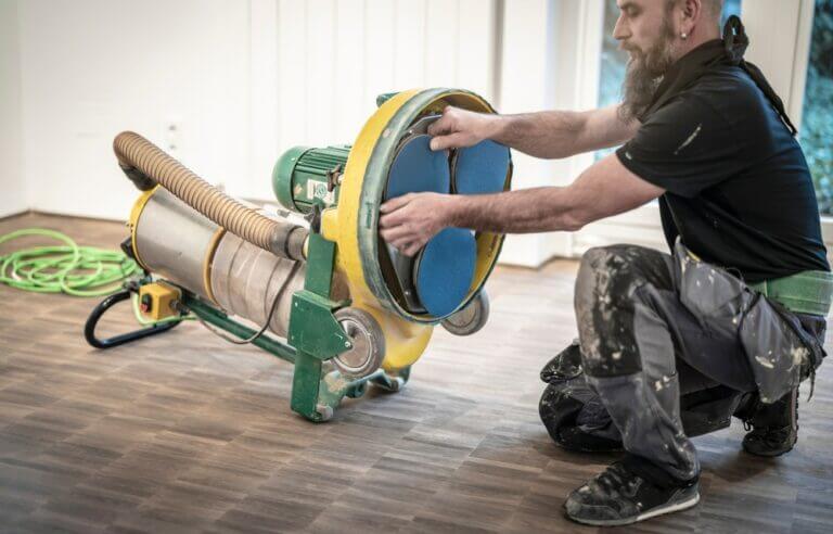 Craftsman,Changes,The,Sanding,Pads,On,The,Parquet,Sanding,Machine