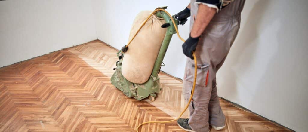 Mr. Sander® professional sanding parquet floor in East Acton, UK using Lagler ELF machine. Specs: 230V, 50Hz, 2.2kW single-phase AC motor with no-voltage release and thermal overload protection. Sanding drum width: 200mm, Drum speed: 2400 rpm, Machine weight: 77-81kg.