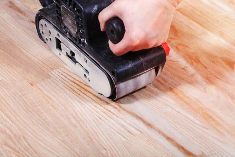 Finishing,Ashwood,Surface,By,Hand-held,Belt,Sander