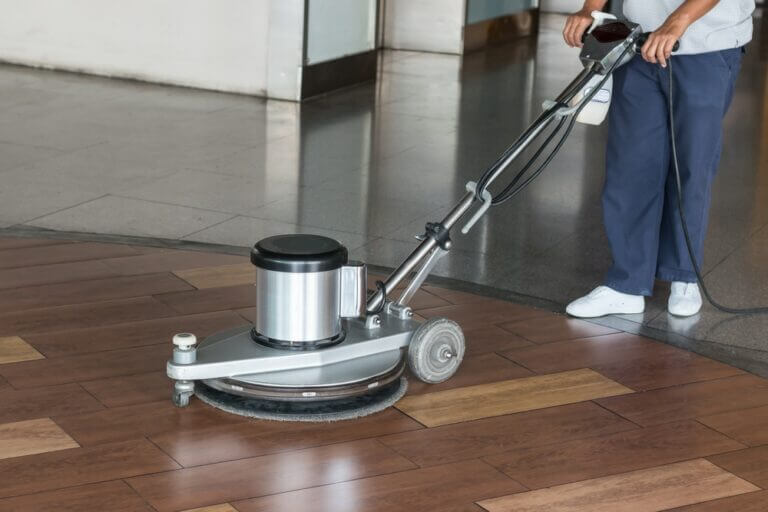 Woman,Worker,Cleaning,The,Floor,With,Polishing,Machine