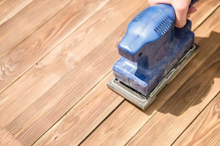 Blue,Grinder,On,Wooden,Floor,,Photo,Above