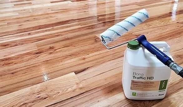 Close-up of newly installed hardwood floor with intricate wood grain patterns.