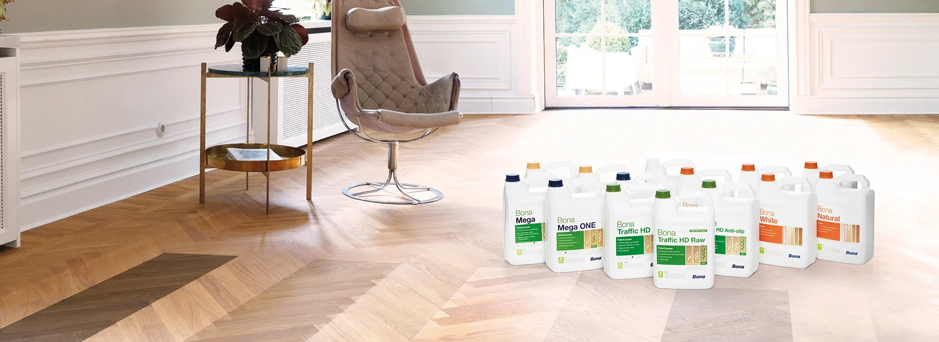 Selection of Bona finishes placed on a light oak herringbone parquet floor, illustrating product choices for varnishing wood floors in a modern living space.