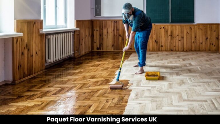 Professional rolling a fresh coat on an oak herringbone parquet floor—precise, even coverage for varnishing wood floors.