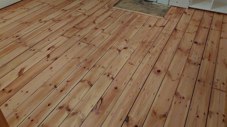 Victorian Pine Floor restored: freshly sanded softwood pine floorboards with visible knots, levelled and prepared for a calm, matt-ready finish.