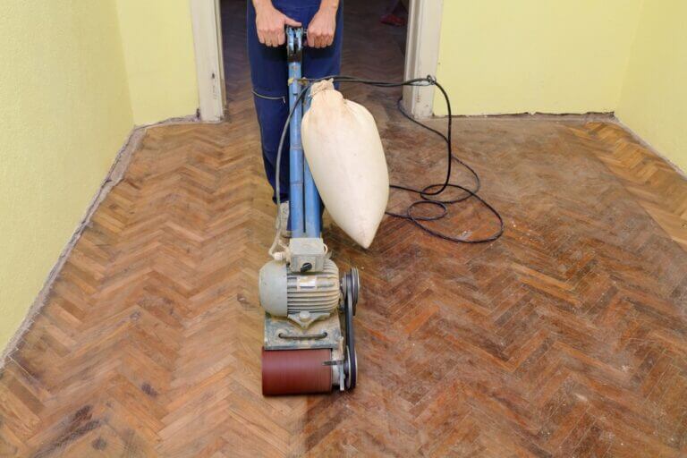 Worker,Polishing,Old,Parquet,Floor,With,Grinding,Machine